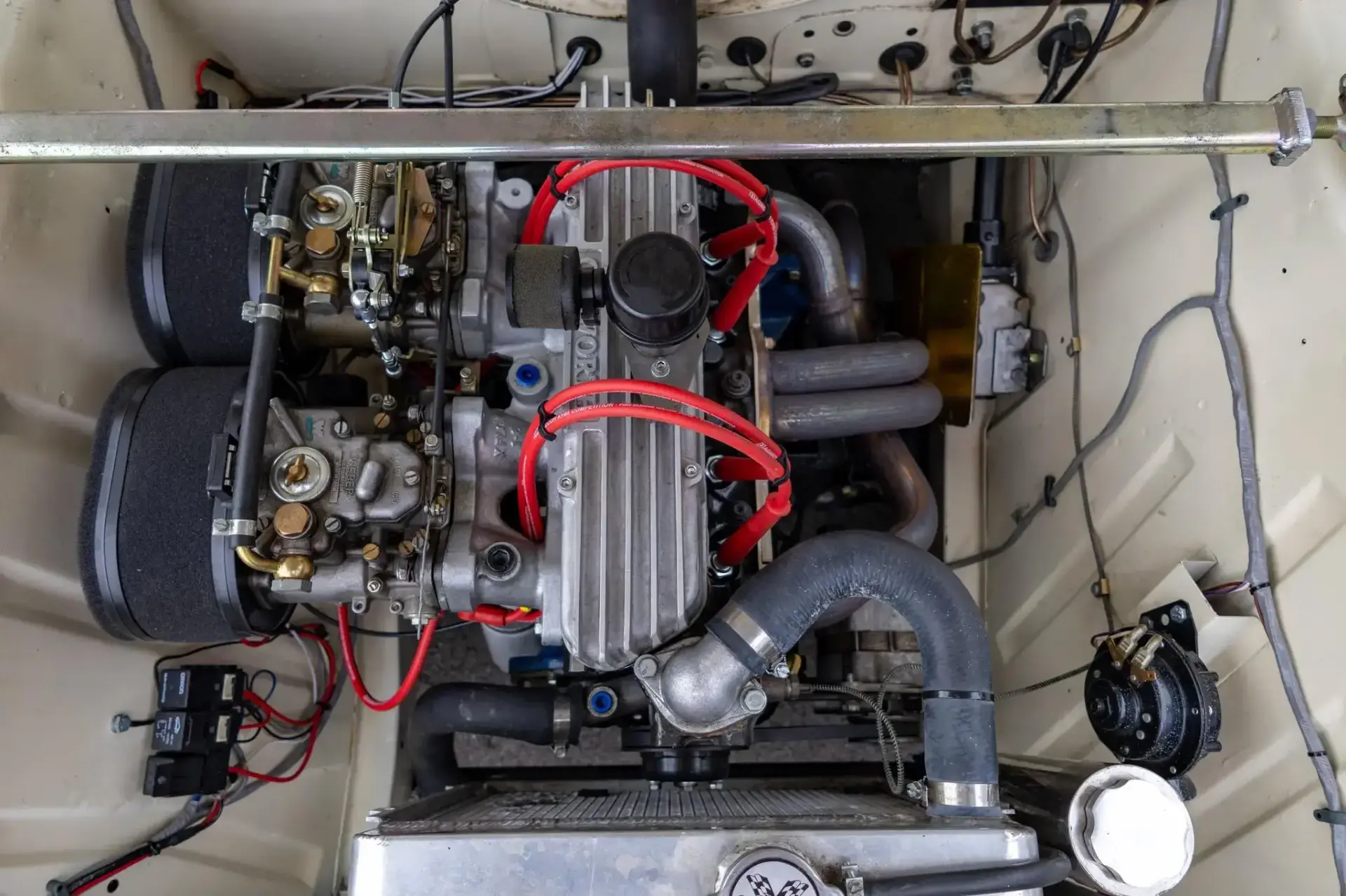 1966 Ford Cortina race engine bay showing Quicksilver-built Kent inline-four with dual Weber carburetors and header