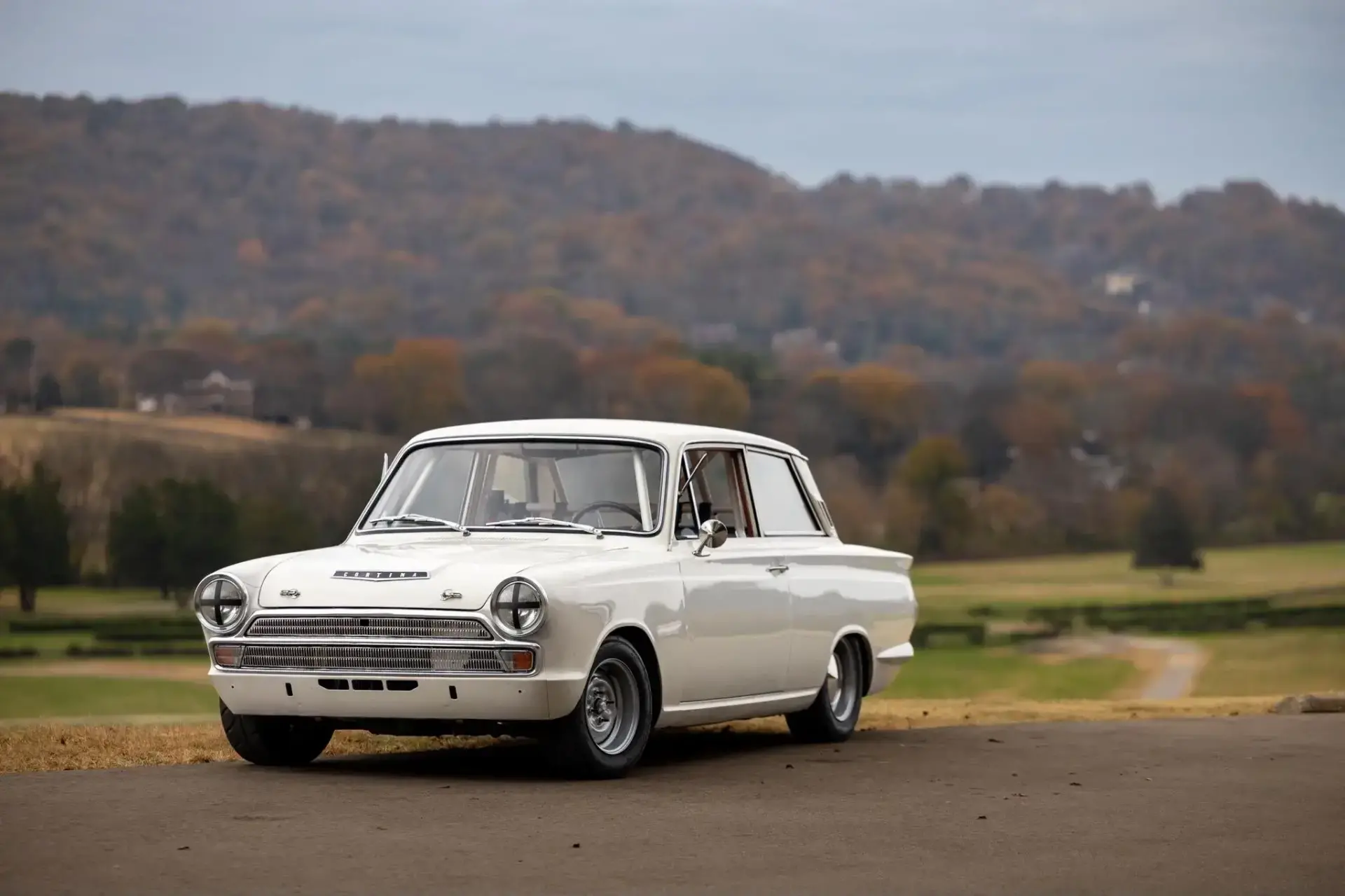 1966 Ford Cortina SCCA race car in Ermine White with racing numbers and period-correct steel wheels