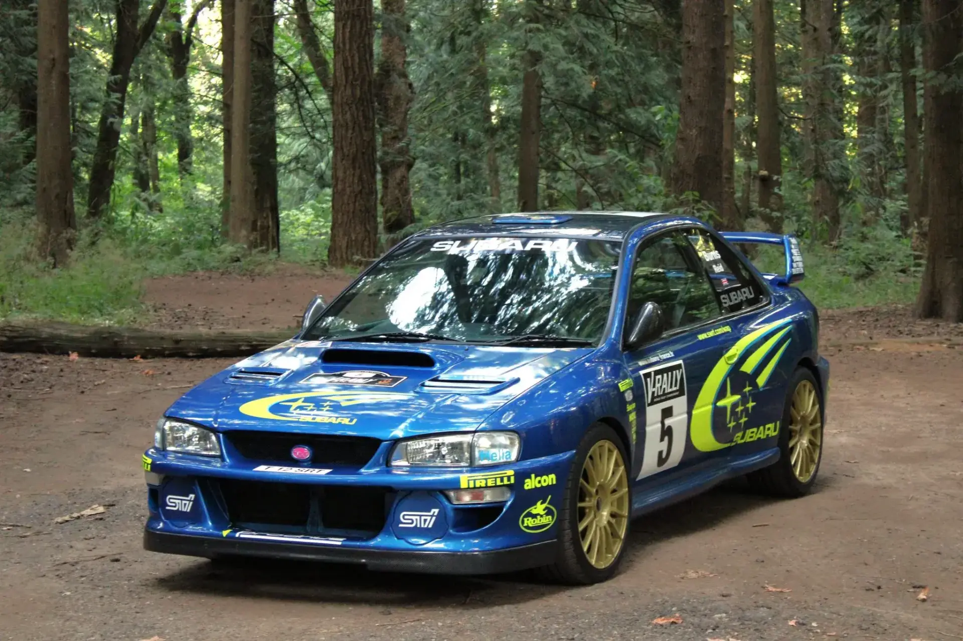 JDM Subaru Impreza 2.5RS with carbon fiber vented roof and rally-inspired blue widebody kit paint scheme