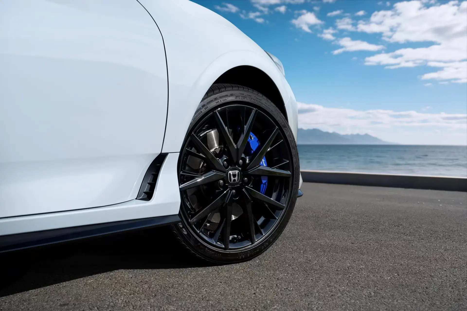 2026 Honda Prelude hybrid coupe rear three-quarter view showcasing sleek profile and integrated LED taillights