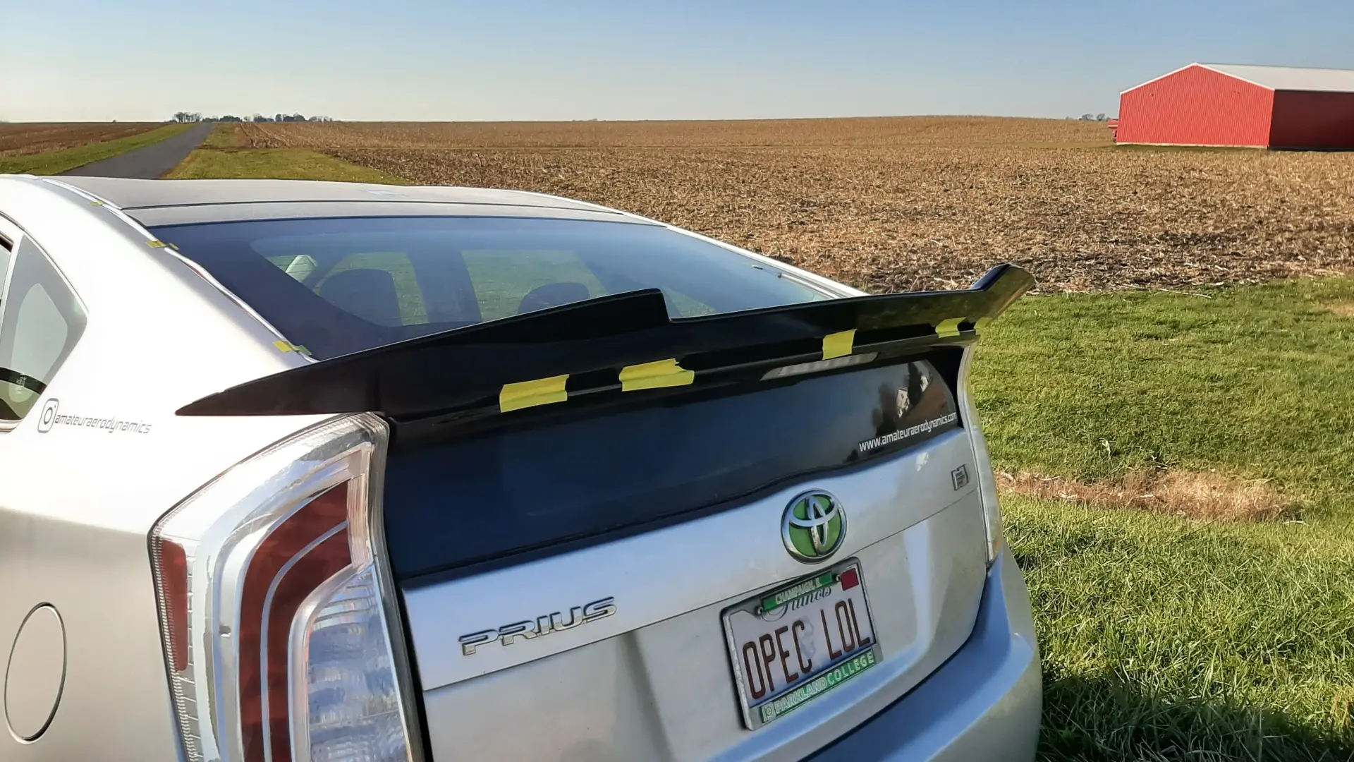 Rear trunk spoiler installation on performance vehicle