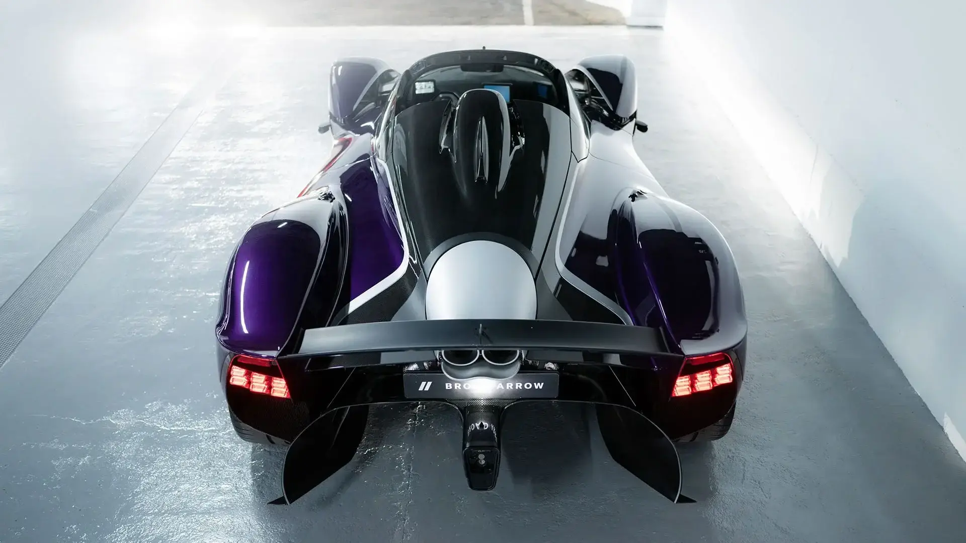 Aston Martin Valkyrie Spider rear three-quarter view showcasing aerodynamic design and exposed suspension