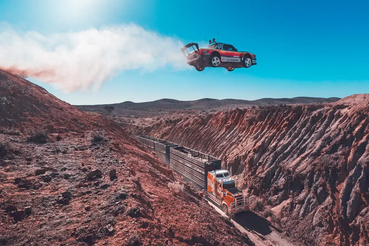 Custom Subaru Brataroo retro pickup with rally livery and aggressive stance performing drift in gymkhana course