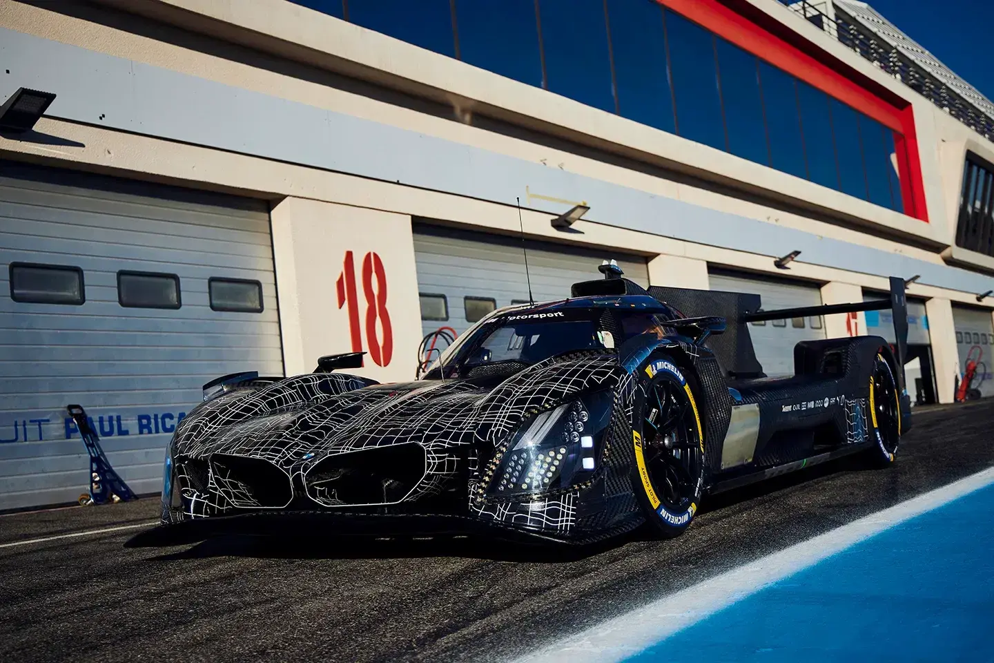 BMW M Hybrid V8 2026 with updated kidney grilles and yellow-tinted headlights at Daytona testing