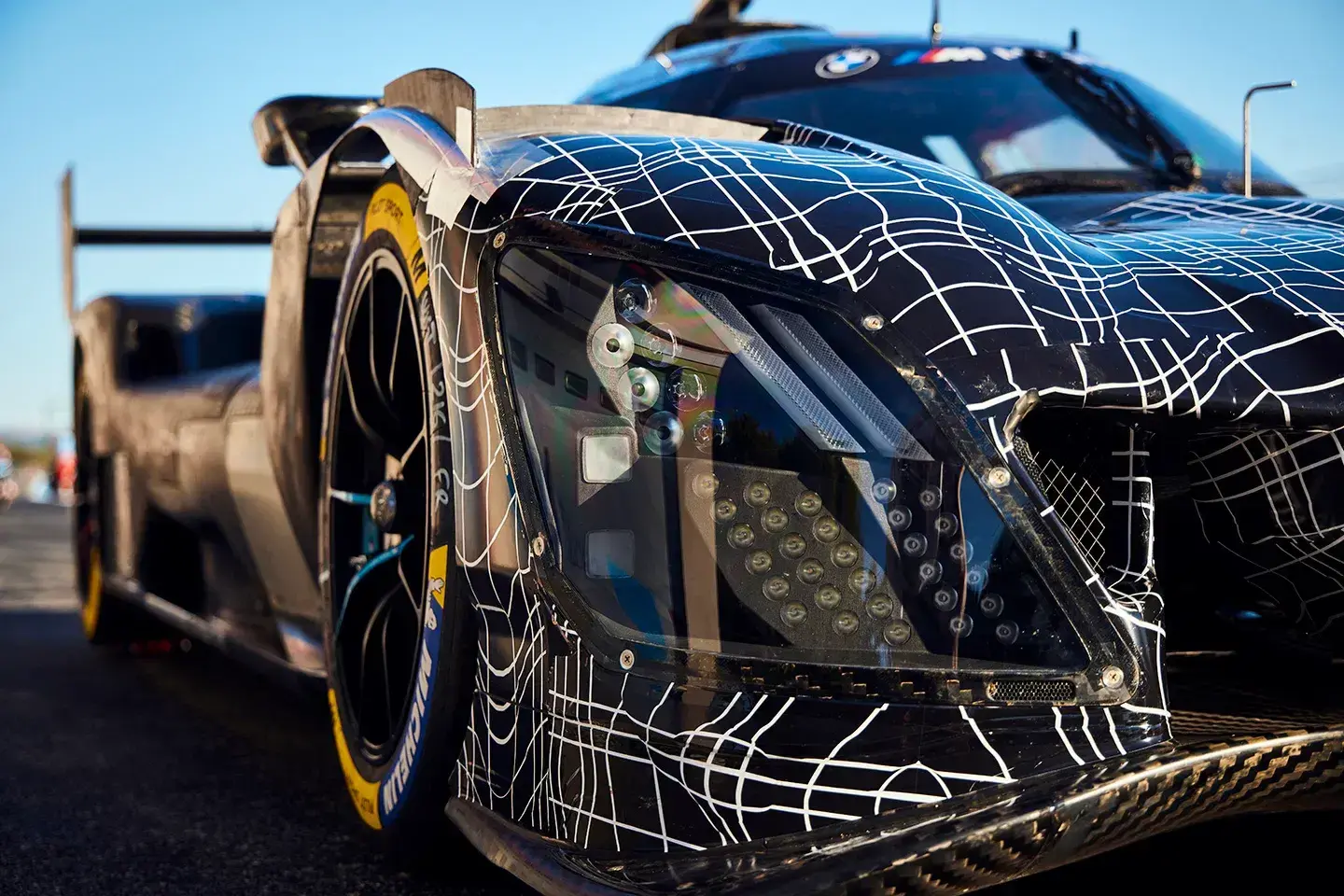 BMW M Hybrid V8 2026 rear three-quarter view highlighting aerodynamic package and racing livery