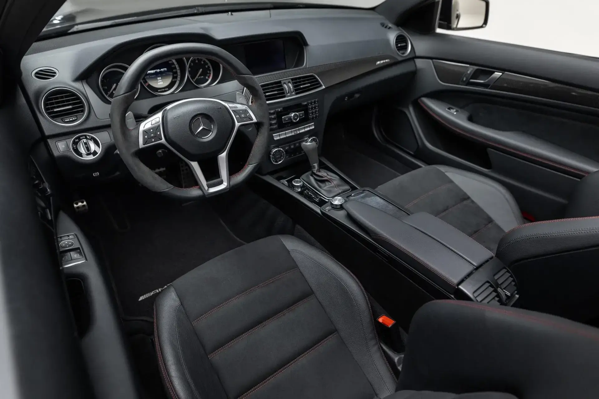 2012 Mercedes-Benz C63 AMG Black Series interior showing Black leather sport seats with Dinamica accents and red stitching