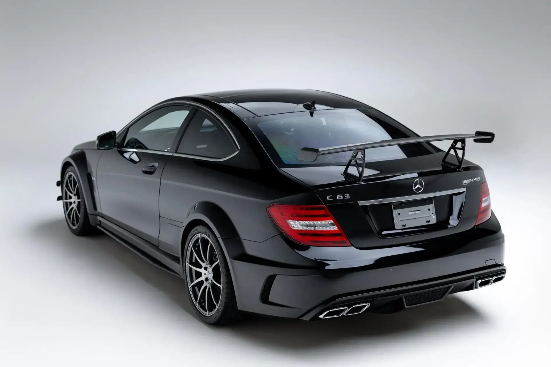 2012 Mercedes-Benz C63 AMG Black Series side profile highlighting widebody proportions and 19-inch forged AMG wheels