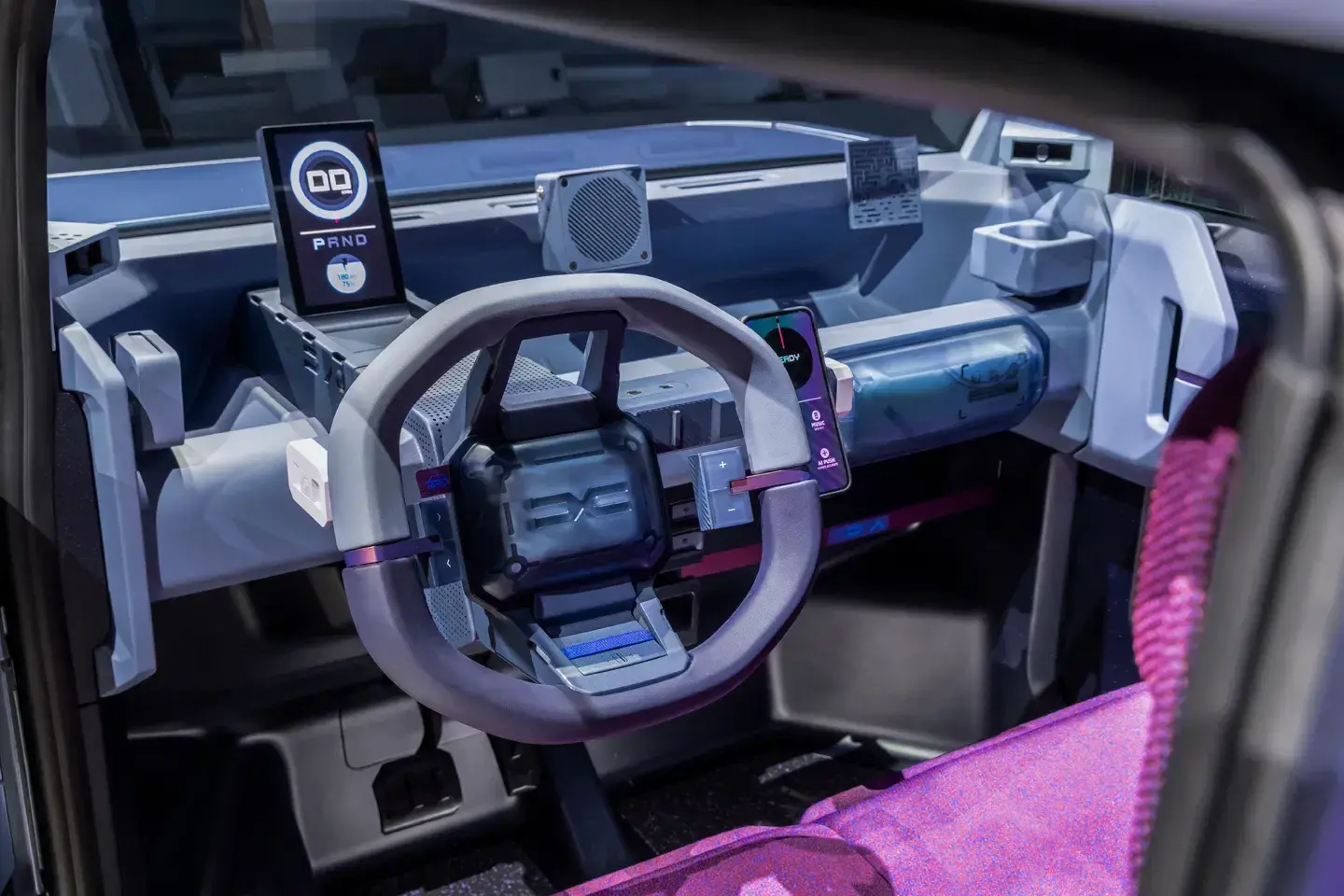 Dacia Hipster dashboard featuring minimalist instrument cluster, smartphone app integration, and translucent passenger airbag cover design