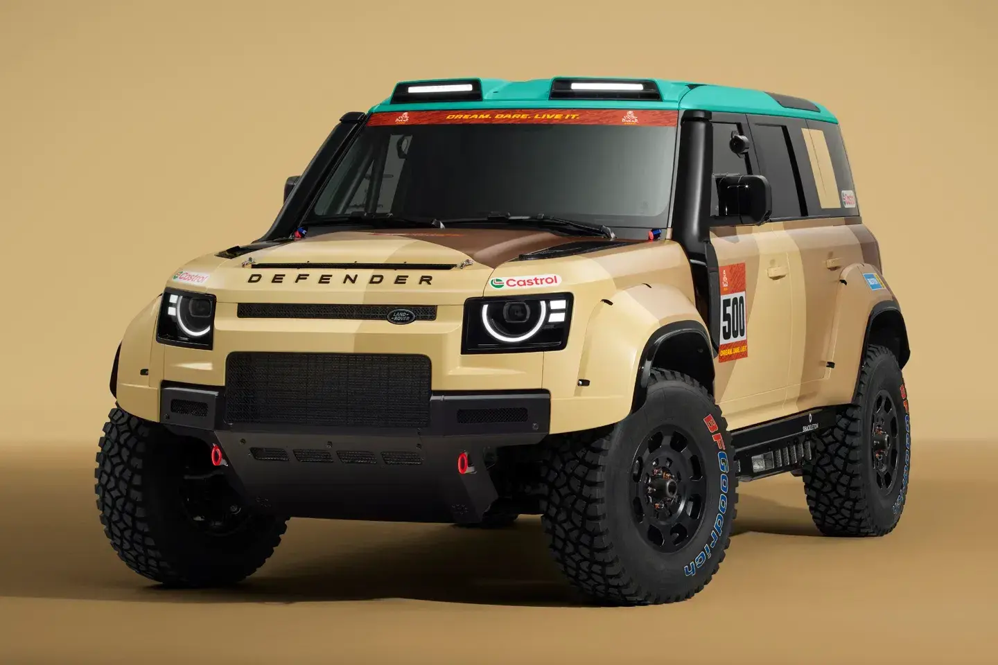 2026 Land Rover Defender Dakar D7X-R rally racer in Geopalette livery with sandy beige and aqua accents