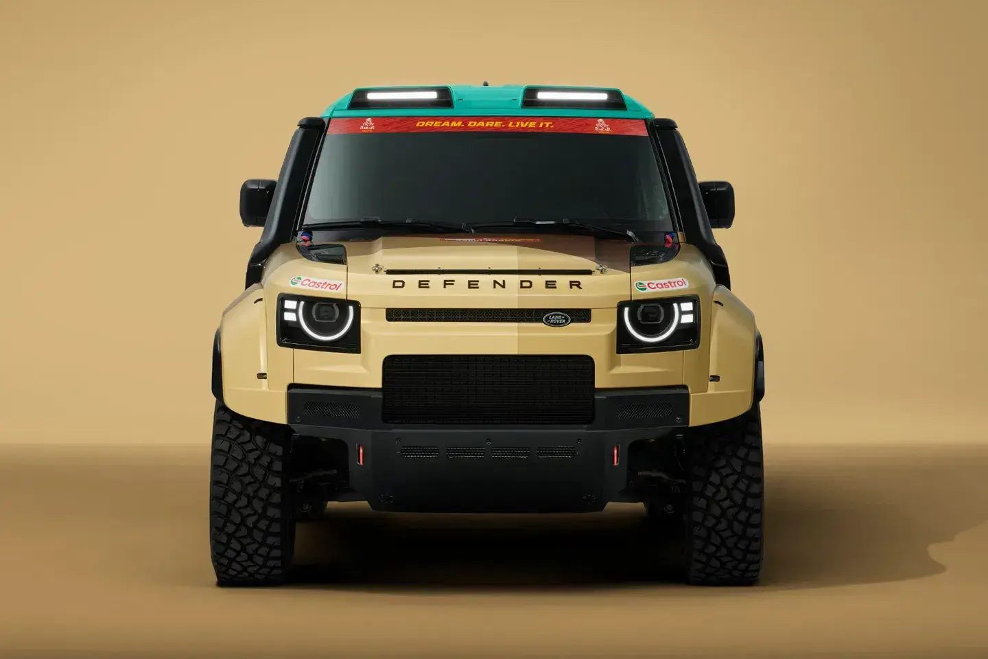 2026 Land Rover Defender D7X-R side profile showcasing rally-raid proportions with composite fender flares and race livery