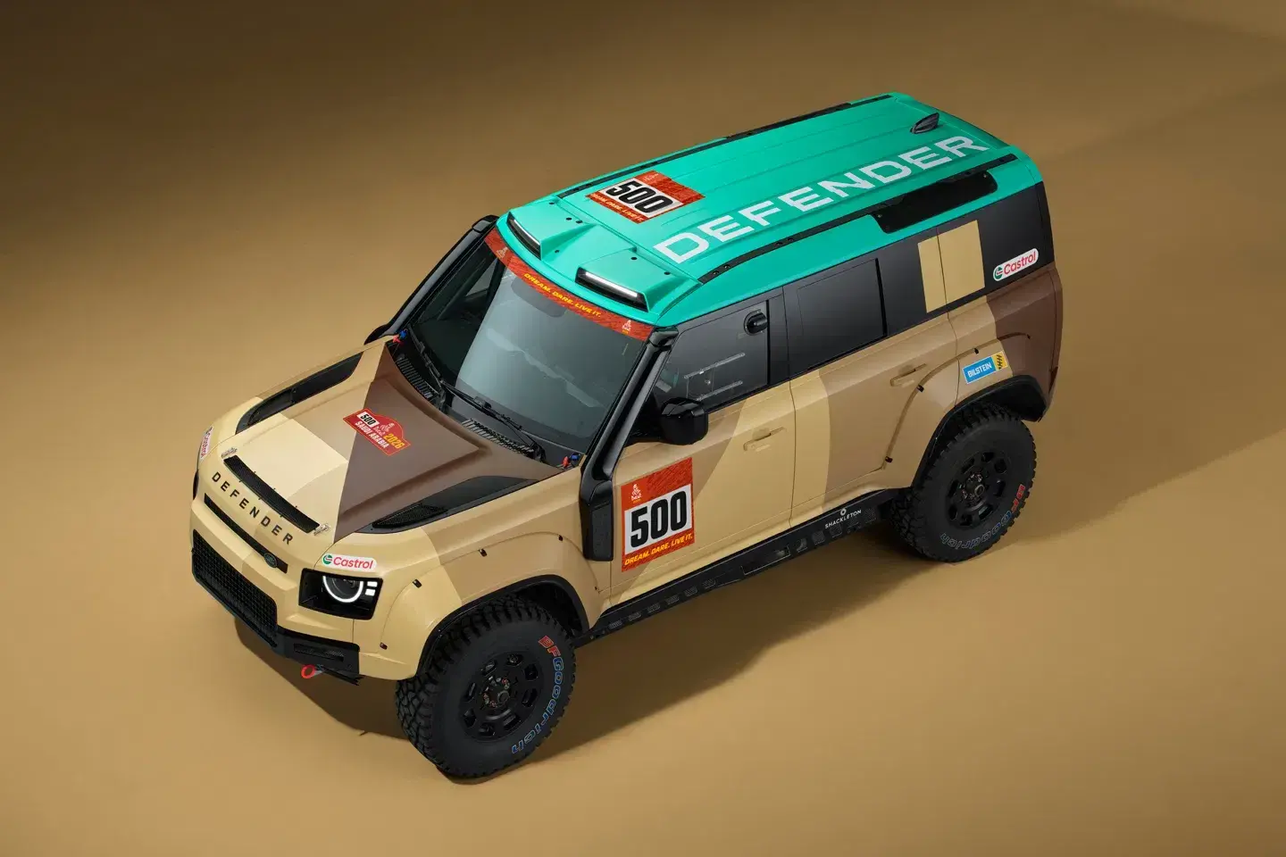 2026 Land Rover Defender D7X-R front view showing enlarged radiators and reworked grille for enhanced desert cooling