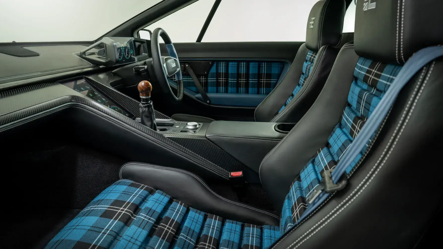 Encor Series 1 Lotus Esprit V8 interior showing leather-wrapped steering wheel and modernized switchgear dashboard