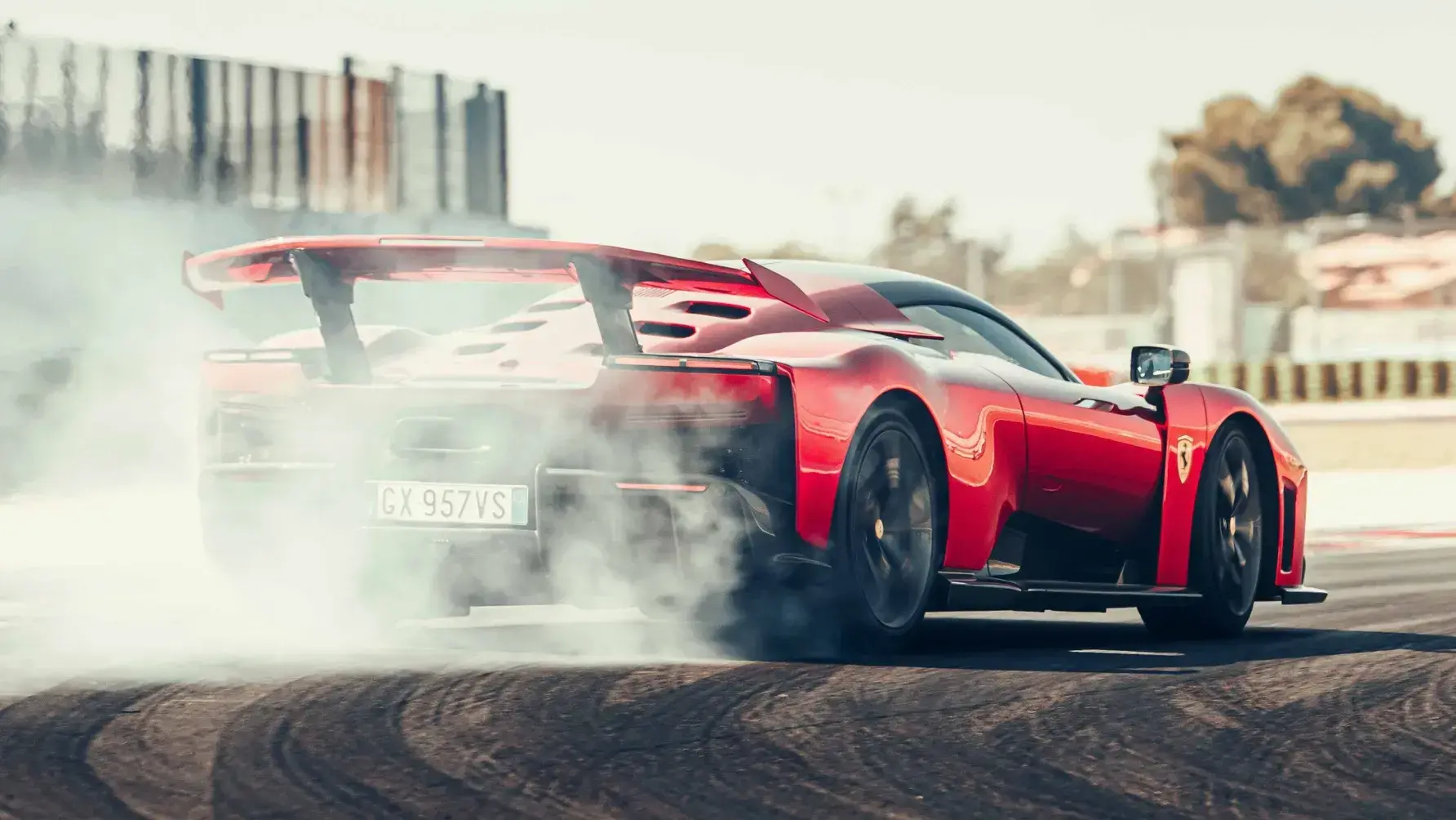 Ferrari F80 in dynamic action on track, demonstrating high-speed cornering capabilities and aerodynamic efficiency
