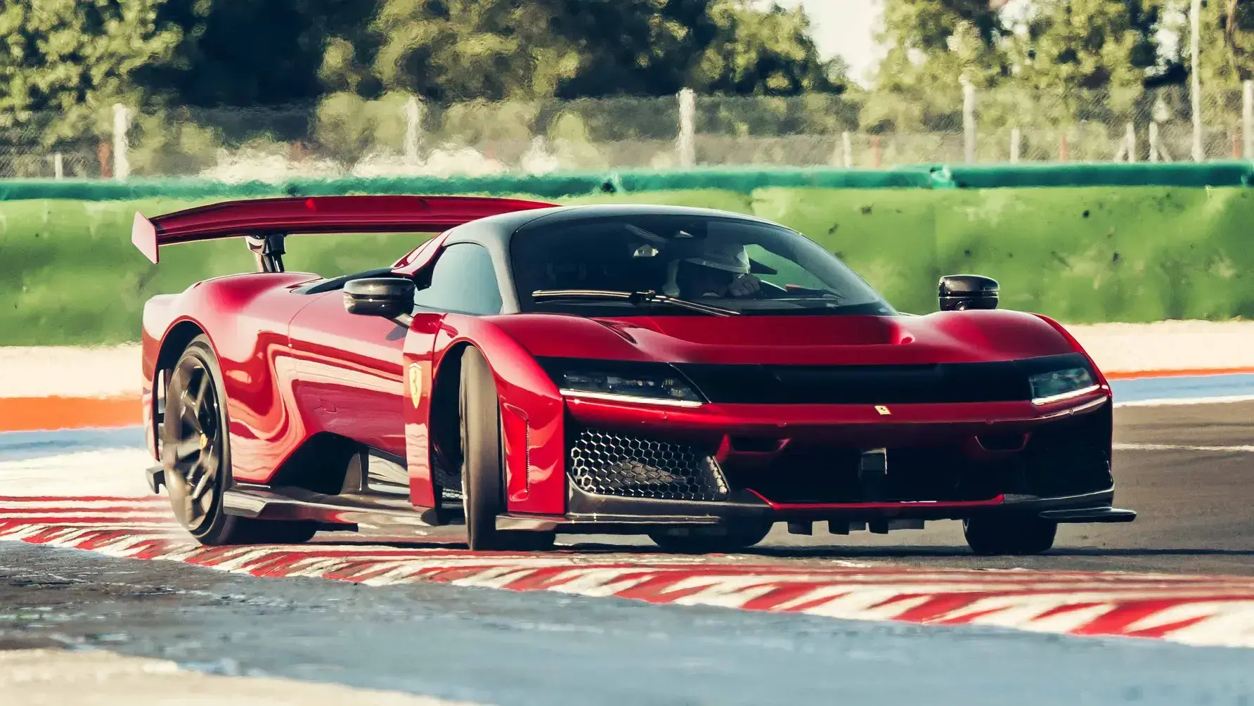 Ferrari F80 engine bay showing the compact twin-turbo V6 hybrid powertrain with visible turbochargers and hybrid components
