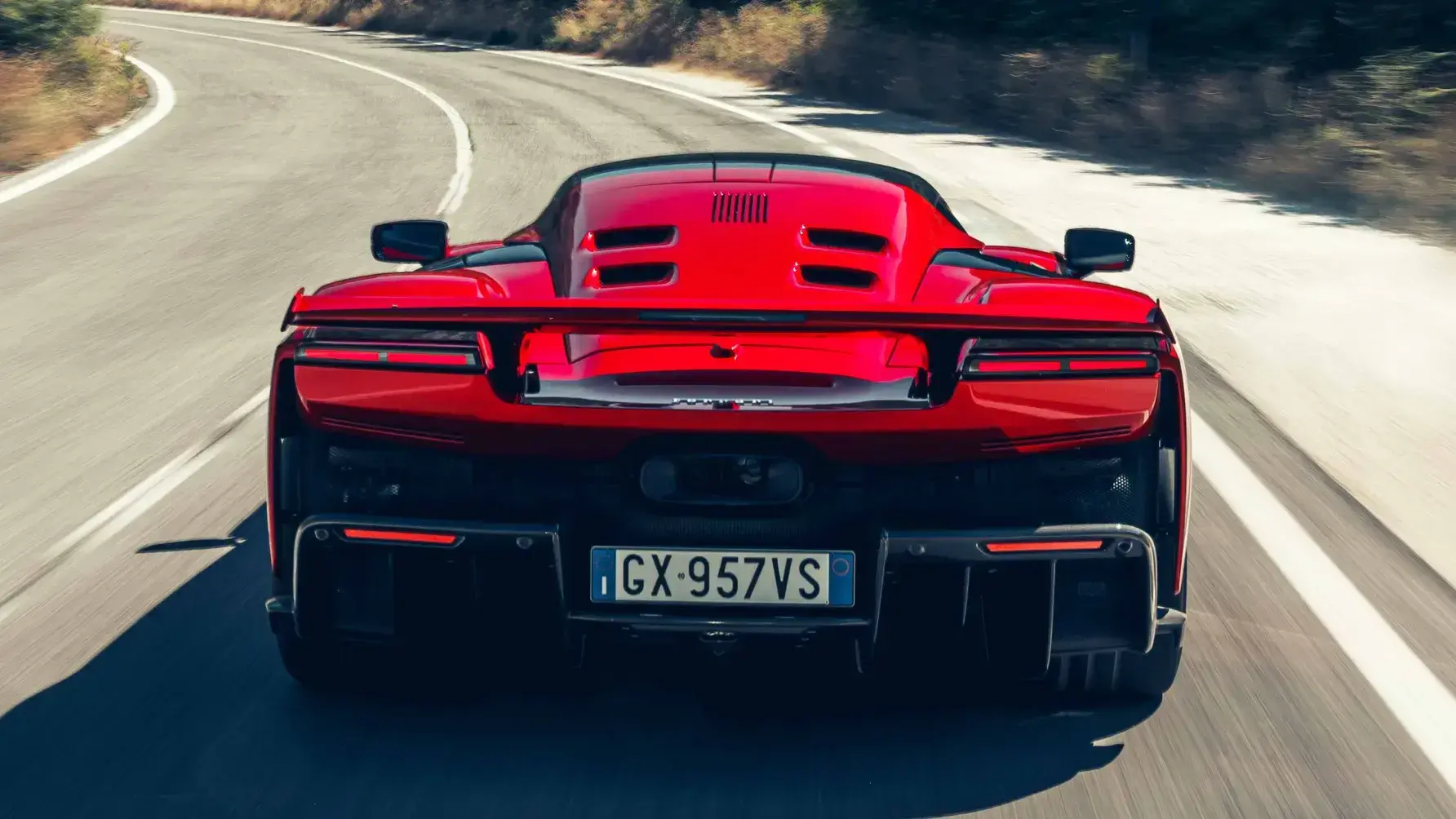Ferrari F80 rear view showcasing active aerodynamic elements, massive diffuser, and sophisticated cooling systems