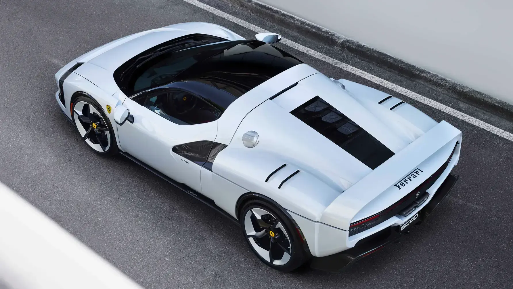 Ferrari SC40 side profile showing fixed rear wing, side ducts, and squared volumes inspired by F40 design language