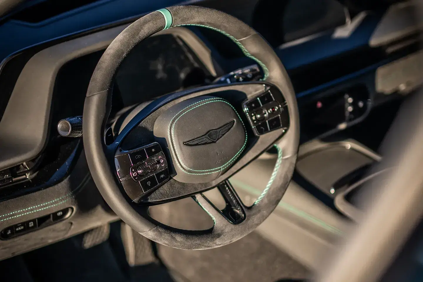 Genesis G90 Wingback Concept interior featuring suede trim with green contrast stitching and production-spec dashboard layout