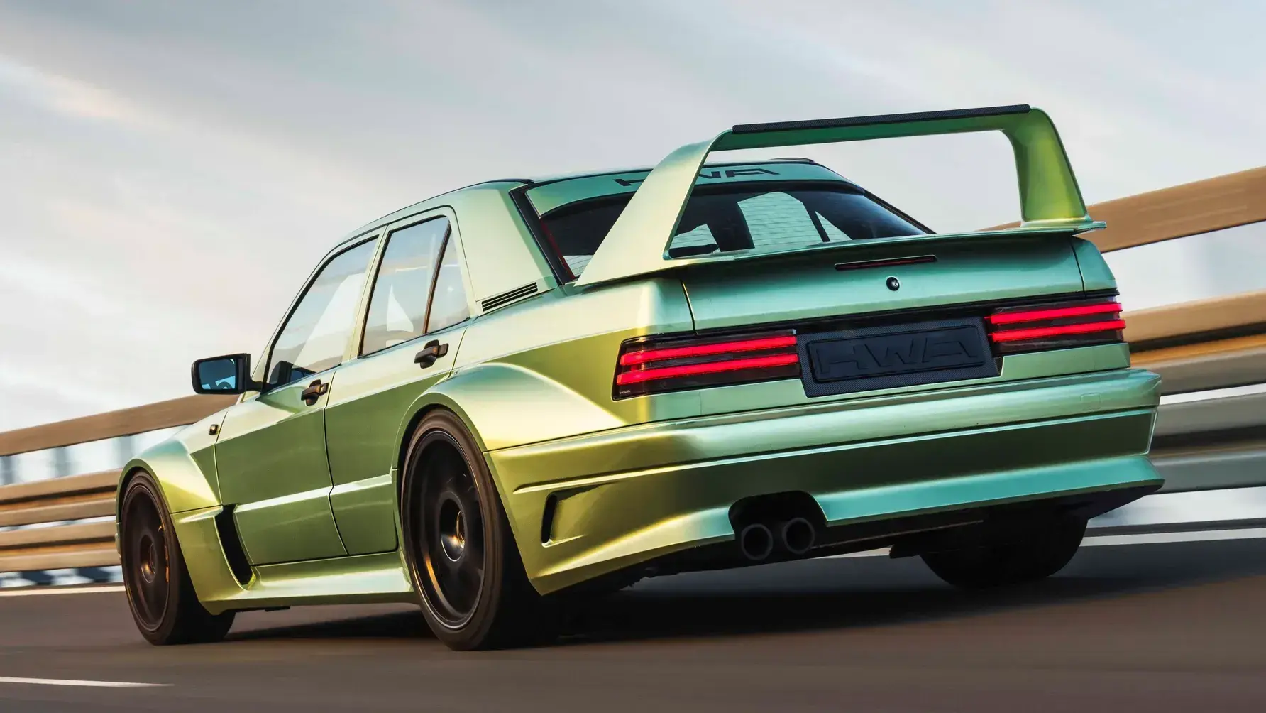 HWA Mercedes 190E Evo II Restomod Front Three-Quarter View HWA Mercedes 190E Evo II restomod exterior featuring iconic rear wing and DTM-inspired widebody design
