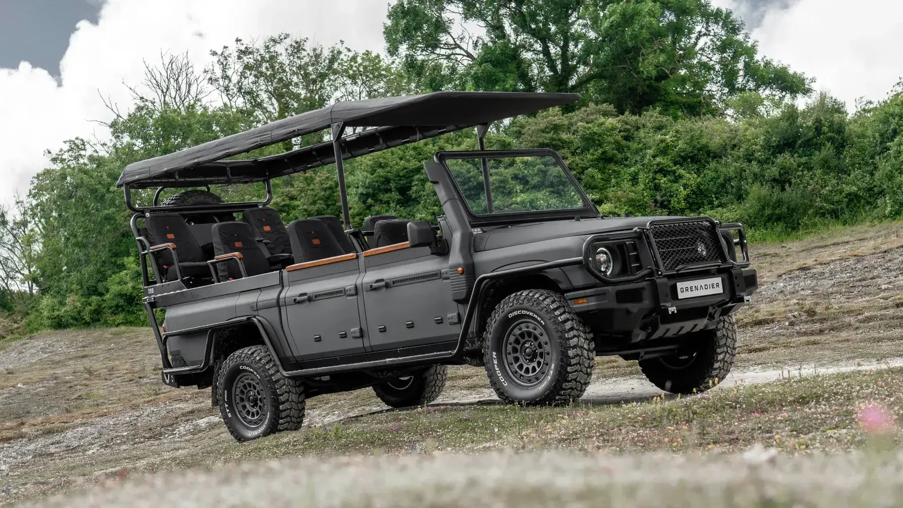 Ineos Grenadier Game Viewer safari 4x4 with elevated open-air seating and rollback canvas roof