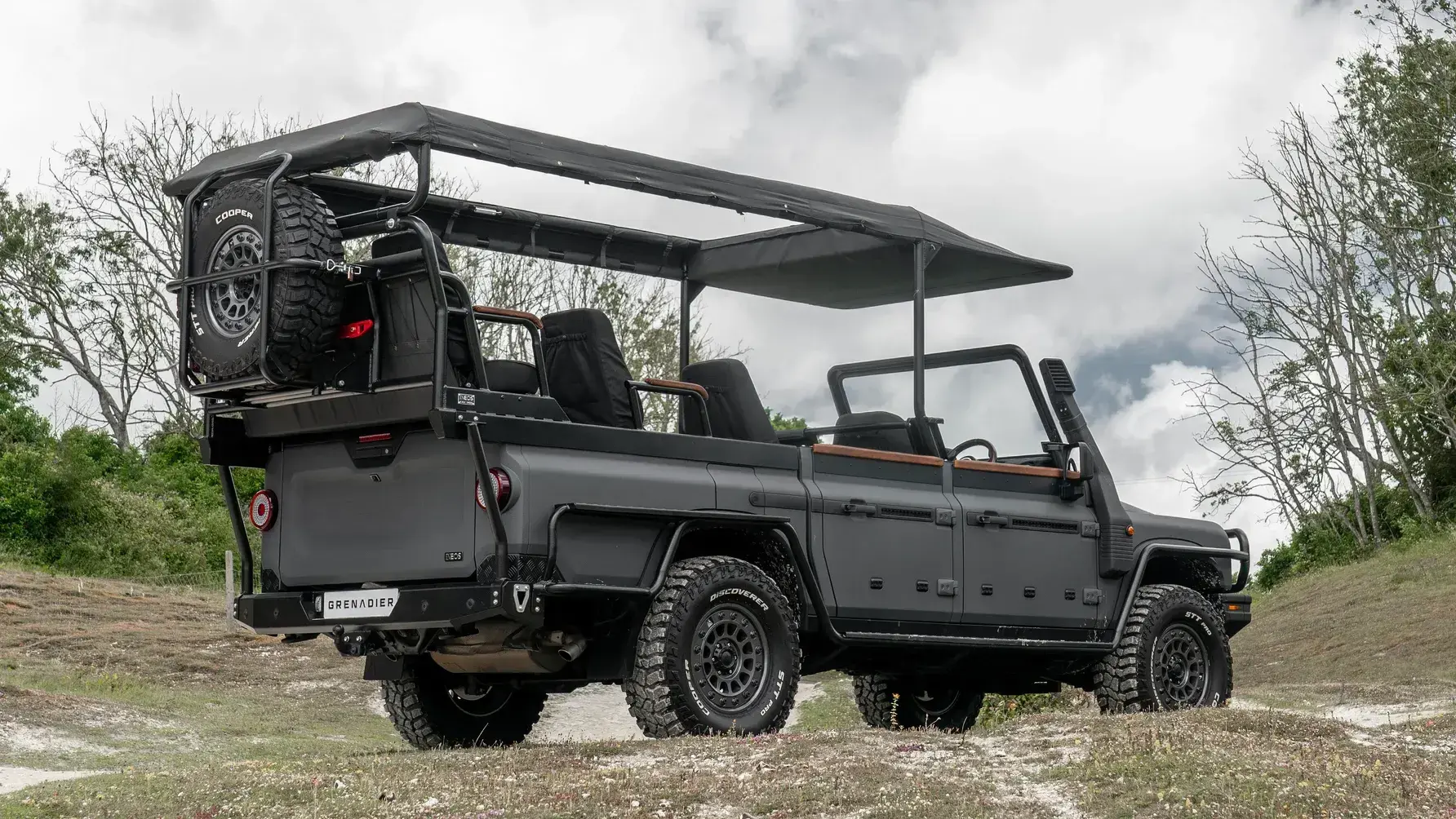 Ineos Grenadier Game Viewer side profile showing elevated seating rows and open-air safari configuration