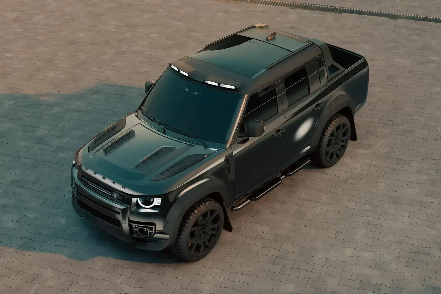 Urban Automotive Defender 130 pickup with aggressive black styling, wide arches, and carbon fiber performance bonnet