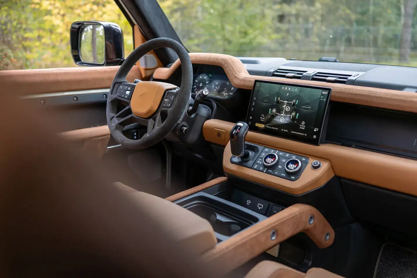 Heritage Customs Defender 130 pickup interior featuring bespoke leather and suede trim with luxury stitching details