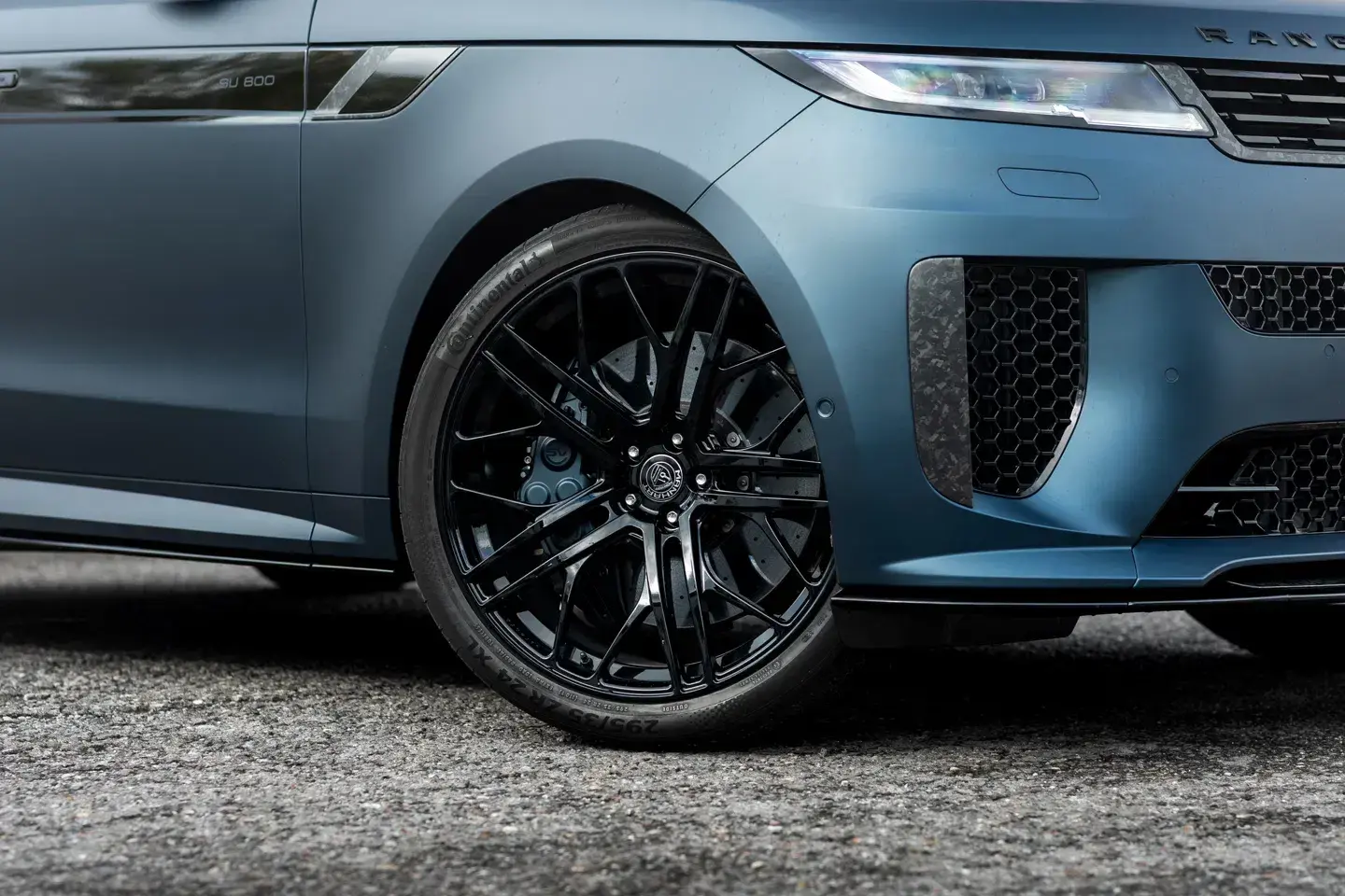 Side profile of Manhart Range Rover Sport SV showcasing lowered suspension and 24-inch forged wheels