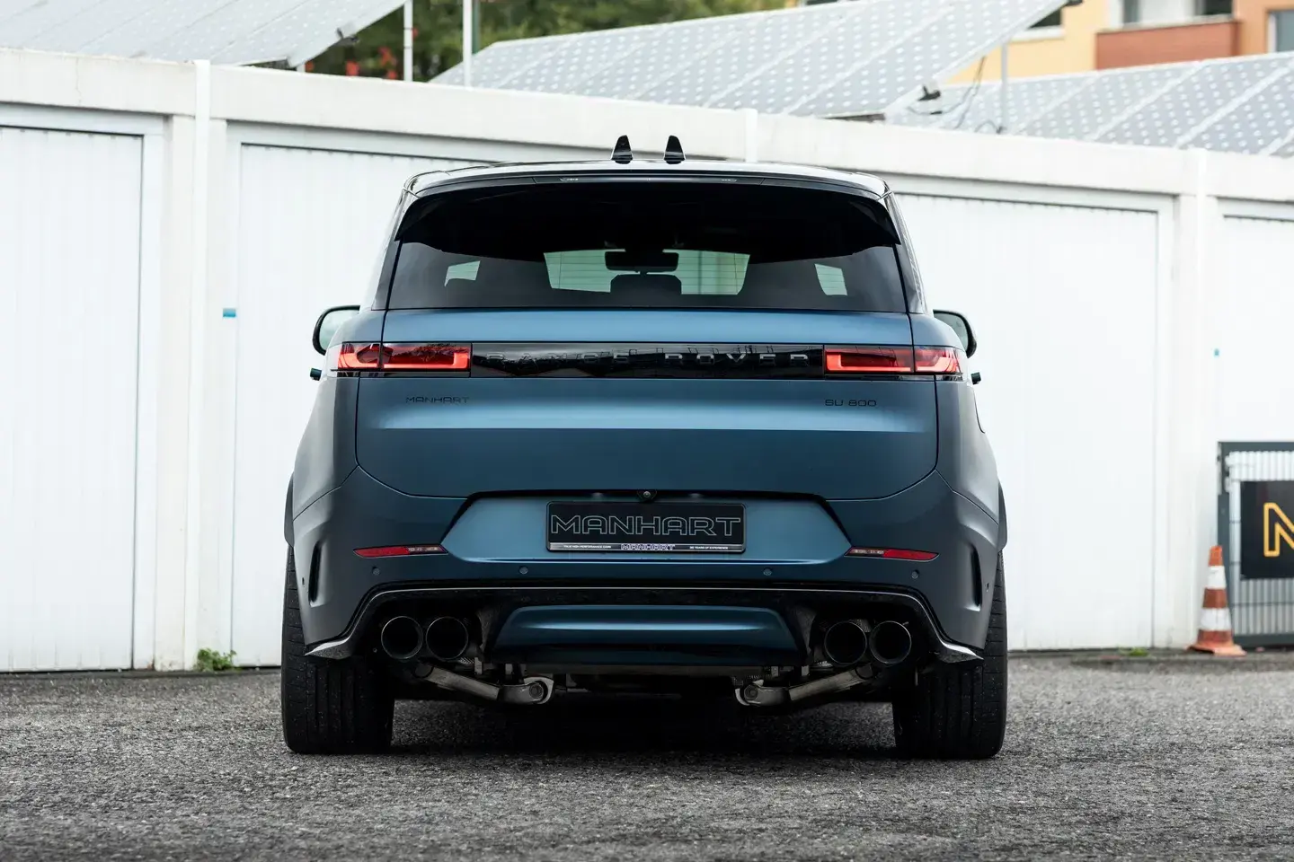 Rear three-quarter view of Manhart Range Rover Sport SV 805HP with custom exhaust system and aerodynamic enhancements