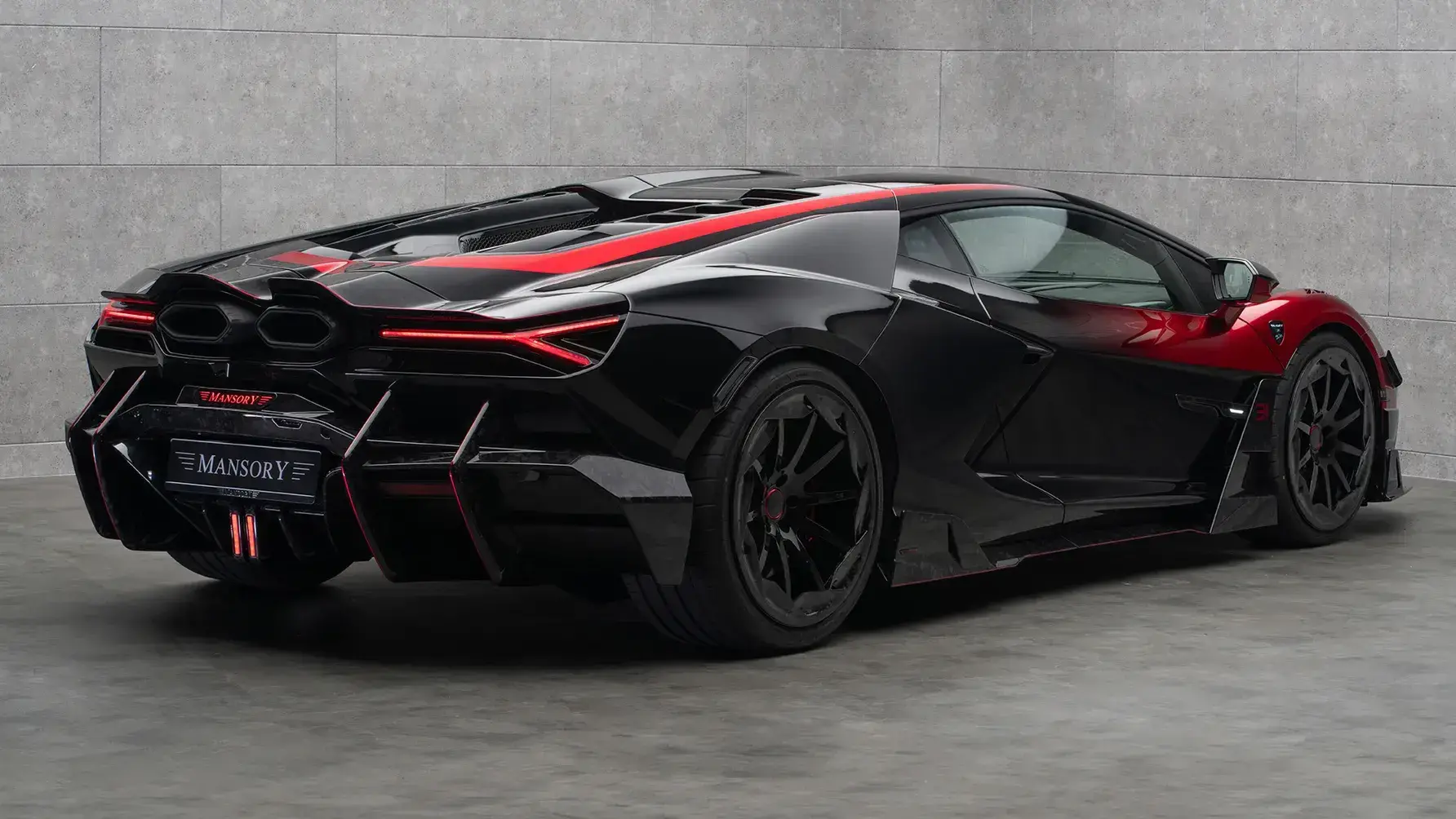 Mansory Lamborghini Revuelto Initiate rear three-quarter view showing widebody kit and bespoke wheels designed for Esteban Ocon
