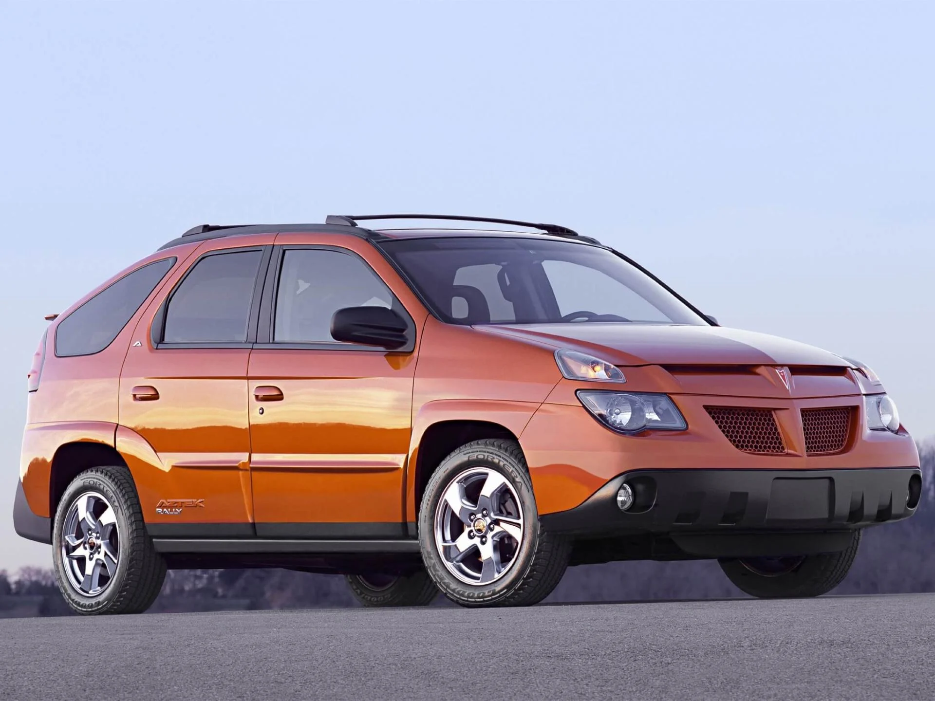 2001 Pontiac Aztek crossover in silver showing controversial angular front fascia with stacked headlights and plastic cladding