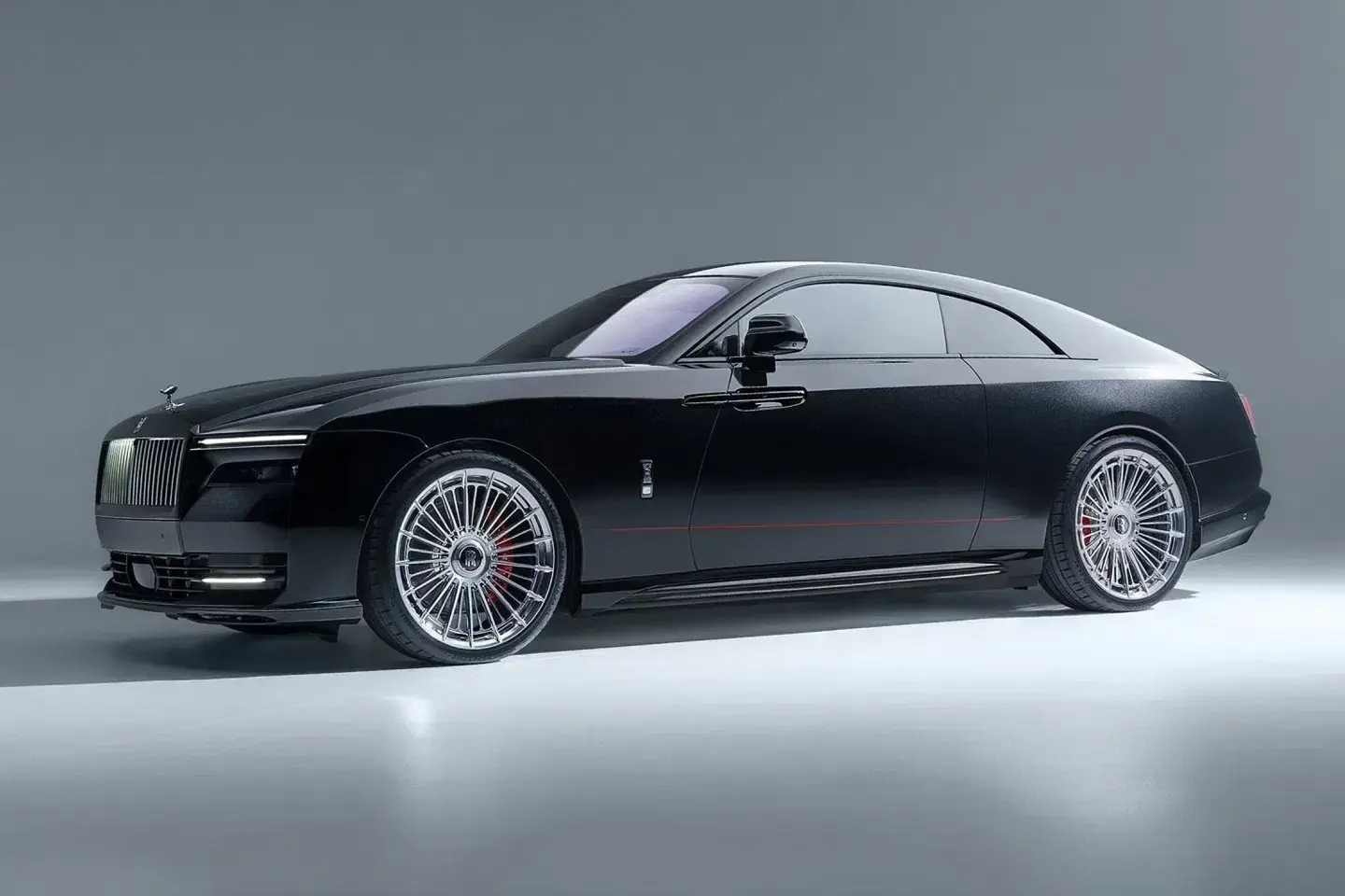 Spofec Rolls-Royce Spectre Black Badge side profile displaying custom 24-inch Vossen SP4 forged wheels with 17-spoke pairs and 35mm lowered suspension