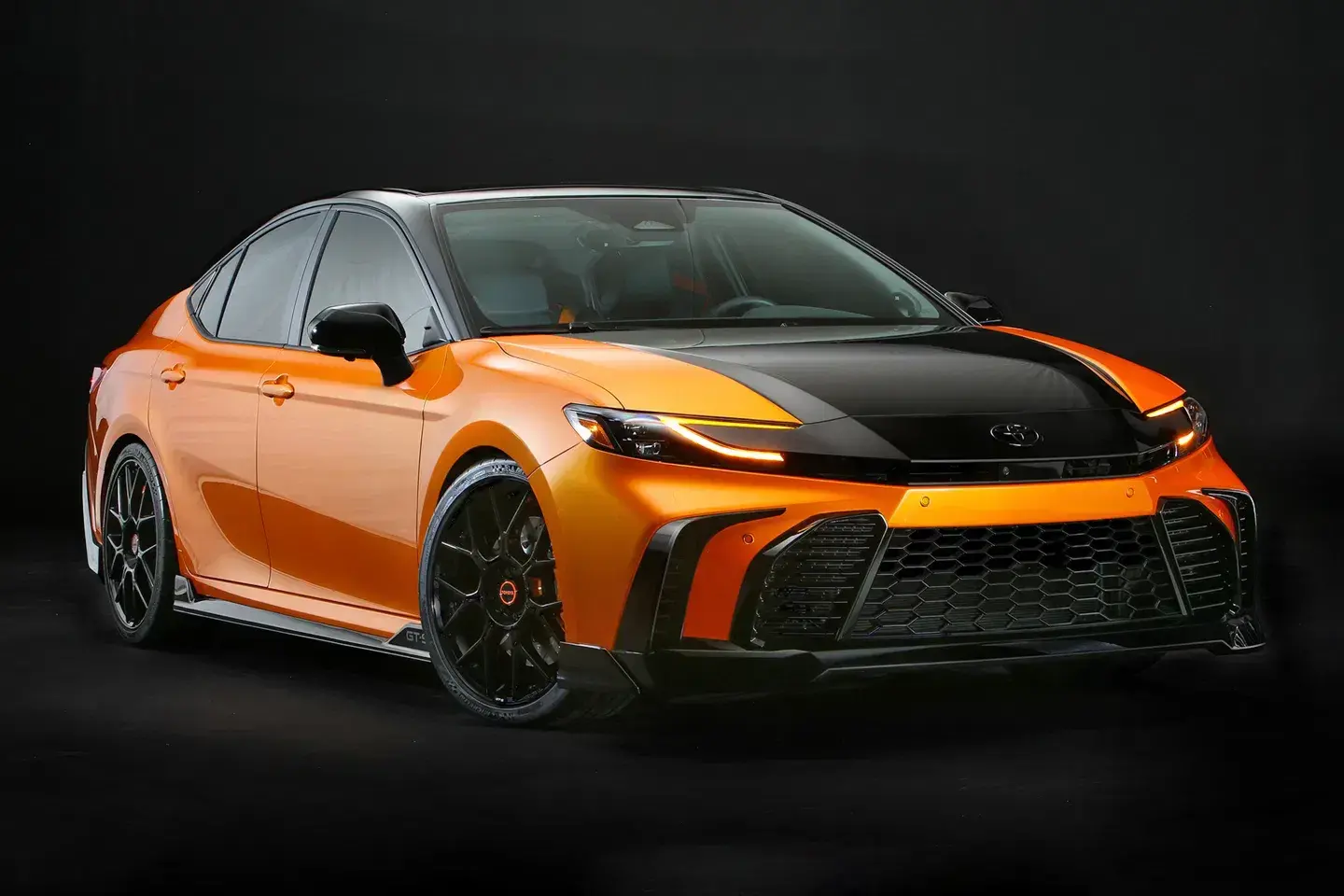 2025 Toyota Camry GT-S Concept - SEMA Show debut Toyota Camry GT-S Concept at SEMA 2025 showcasing Inferno Flare paint and aggressive styling