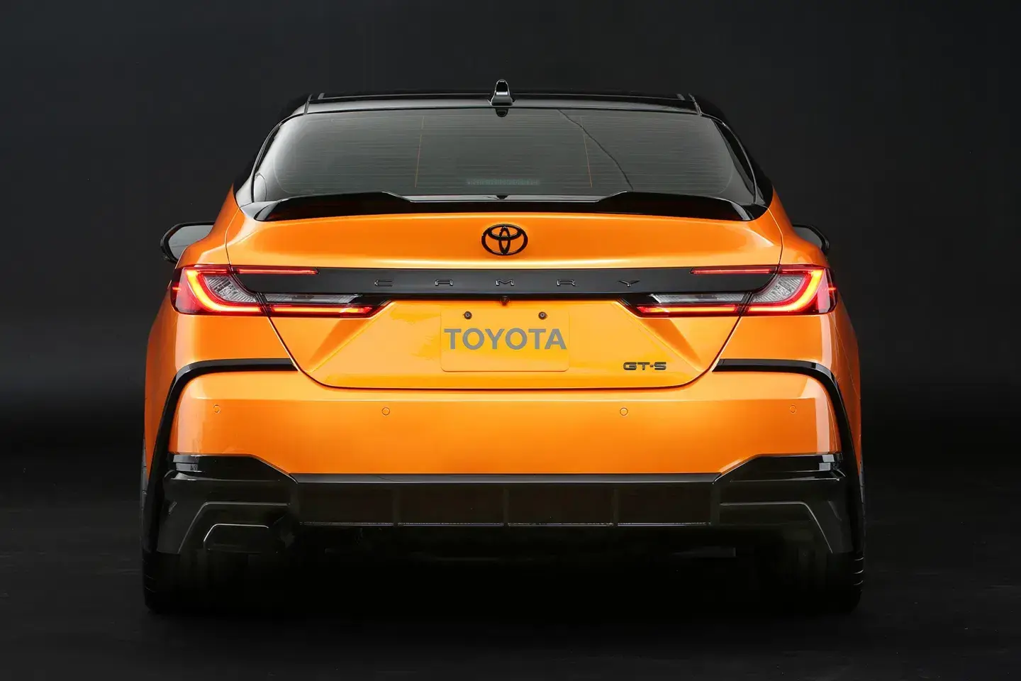 Rear view of the Camry GT-S Concept highlighting performance-inspired design elements Toyota Camry GT-S Concept rear view showing sporty exhaust and aggressive rear styling