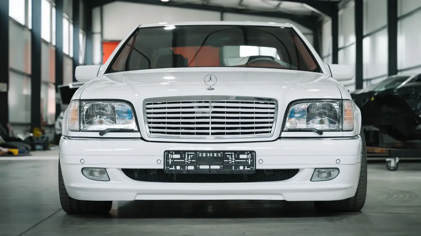 1991 Mercedes-Benz W140 S-Class showcasing double-glazed windows and soft-close doors