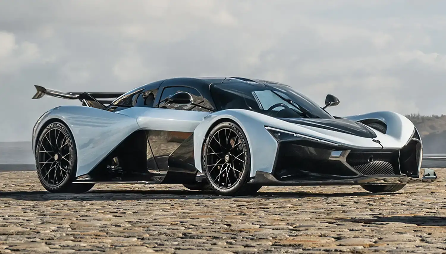 Zenvo Aurora hybrid hypercar in striking blue showing extreme aerodynamics and quad-turbocharged V12 engine